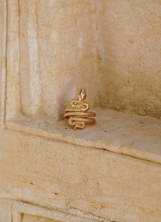 Large Gold plaited serpent ring .....